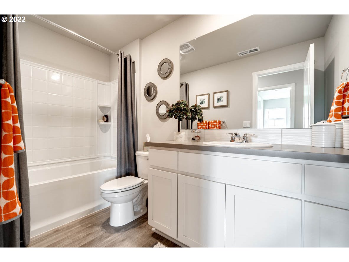 2916 V Street Springfield, OR 97477 - Photo 12 of 14 a bathroom with a sink toilet mirror and shower