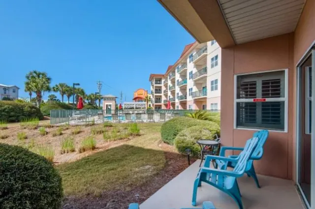 a view of a chairs and table in the patio