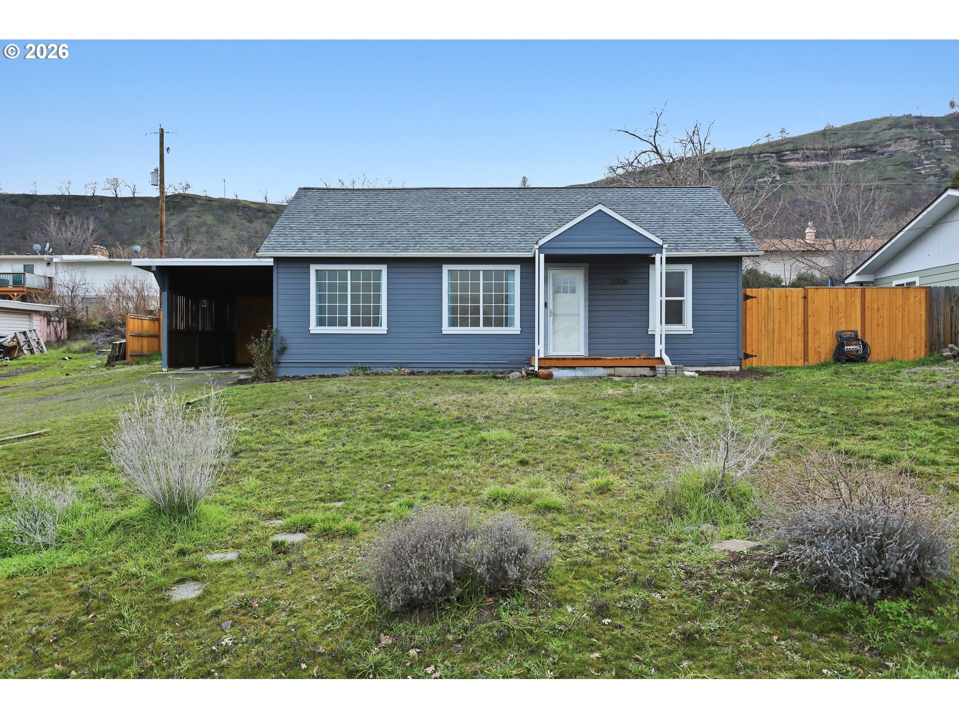 2306 West 13th Street The Dalles, OR 97058 - Photo 2 of 32 a house view with a garden space
