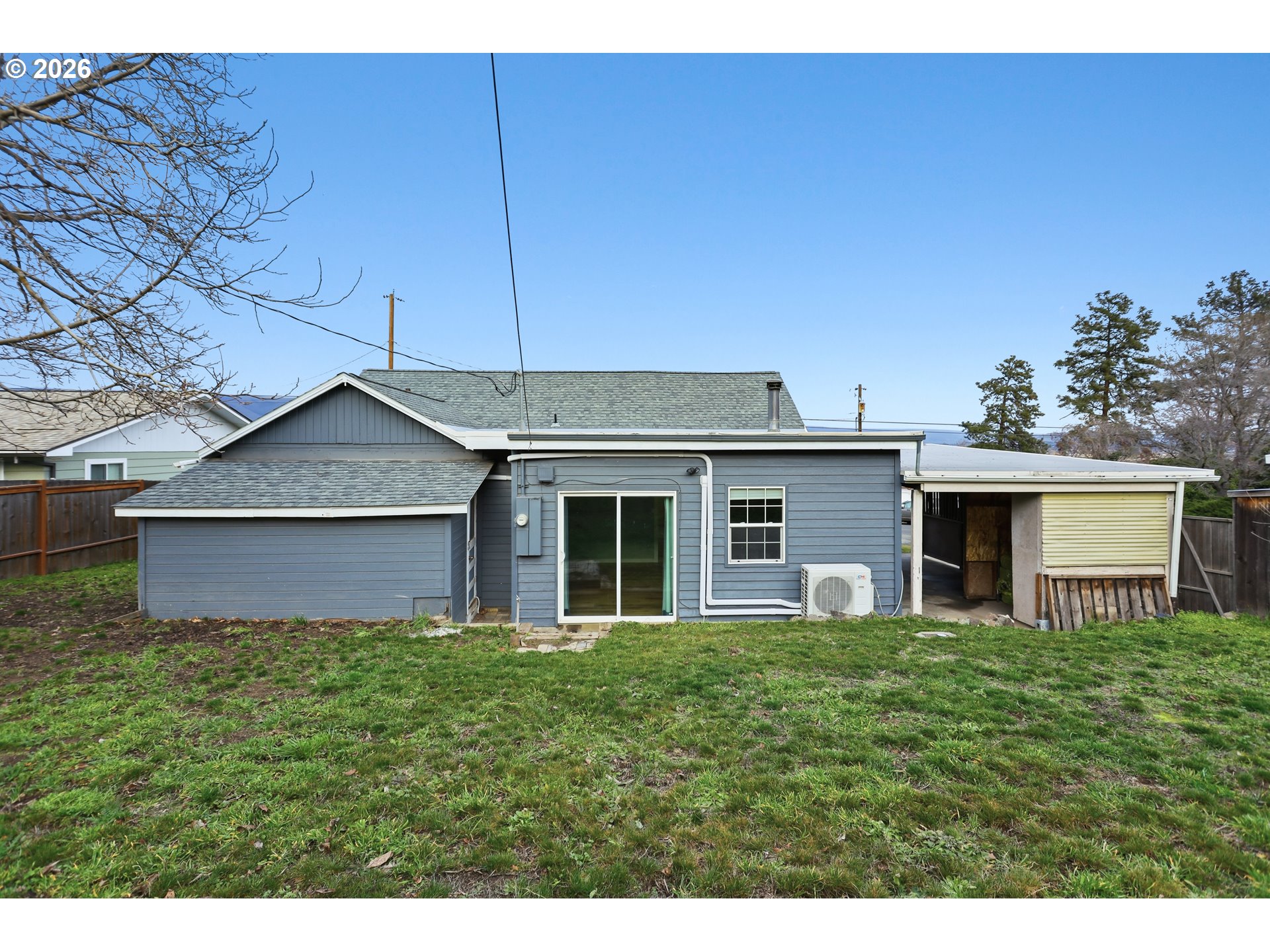 2306 West 13th Street The Dalles, OR 97058 - Photo 26 of 32 a front view of house with a garden