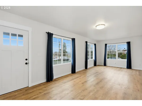a view of an empty room with a window