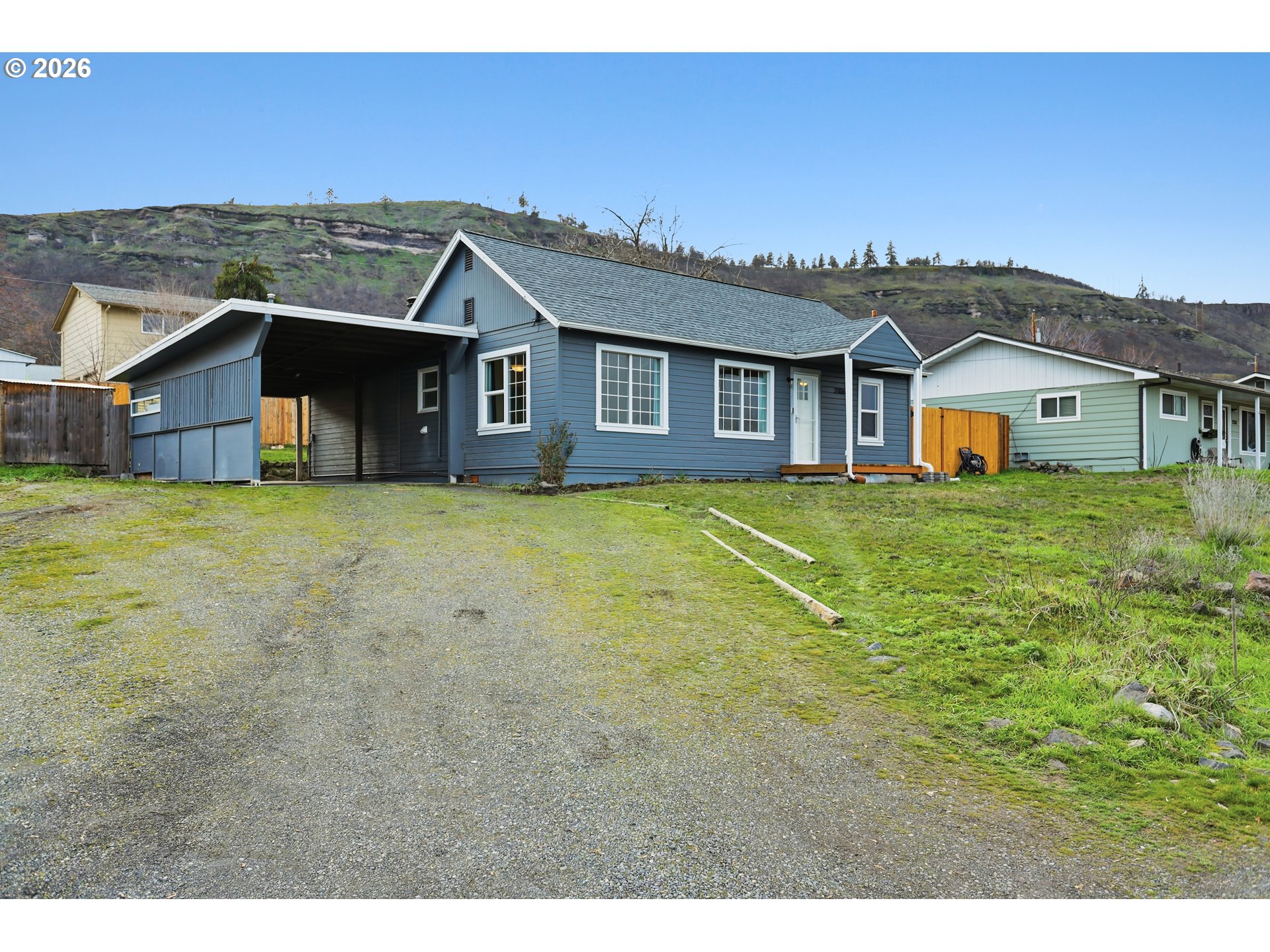 2306 West 13th Street The Dalles, OR 97058 - Photo 32 of 32 a view of a house with a big yard and large trees