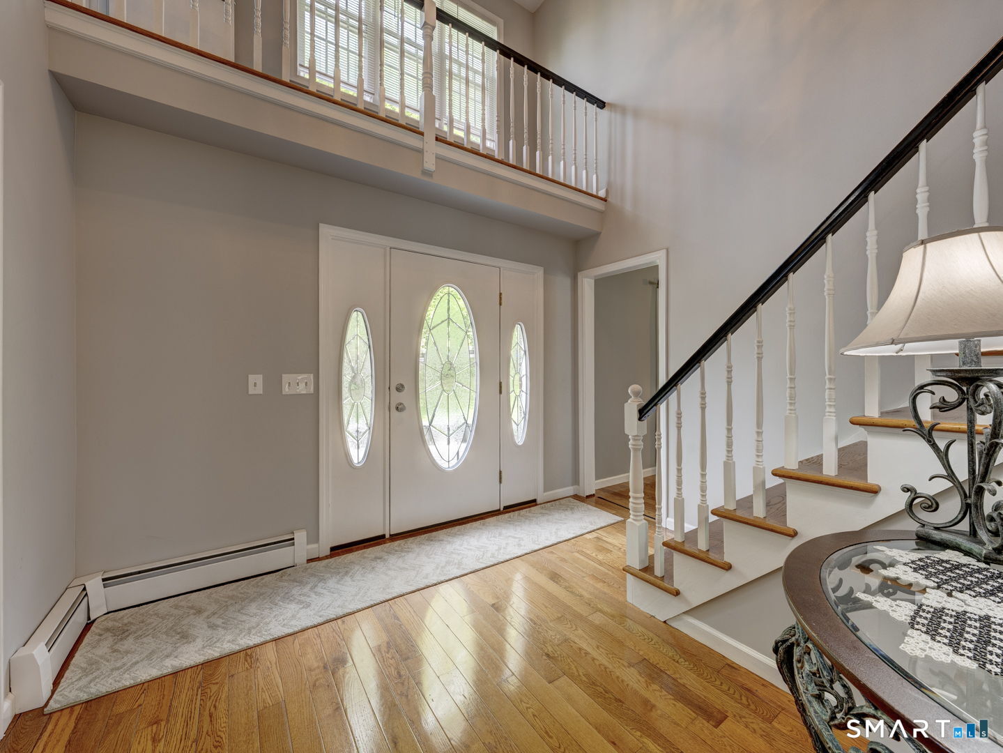 100 Mt Tobe Road Plymouth, CT 06782 - Photo 3 of 35 Light and bright , Front entry foyer , cathedral ceiling , open oak staircase , wood Floors