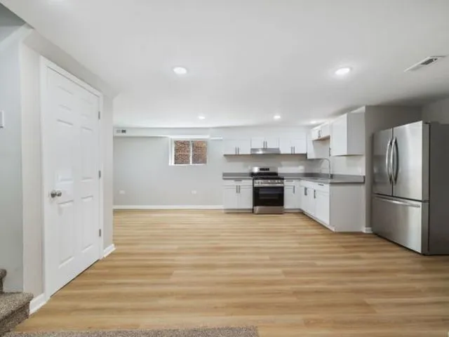 a view of kitchen with wooden floor