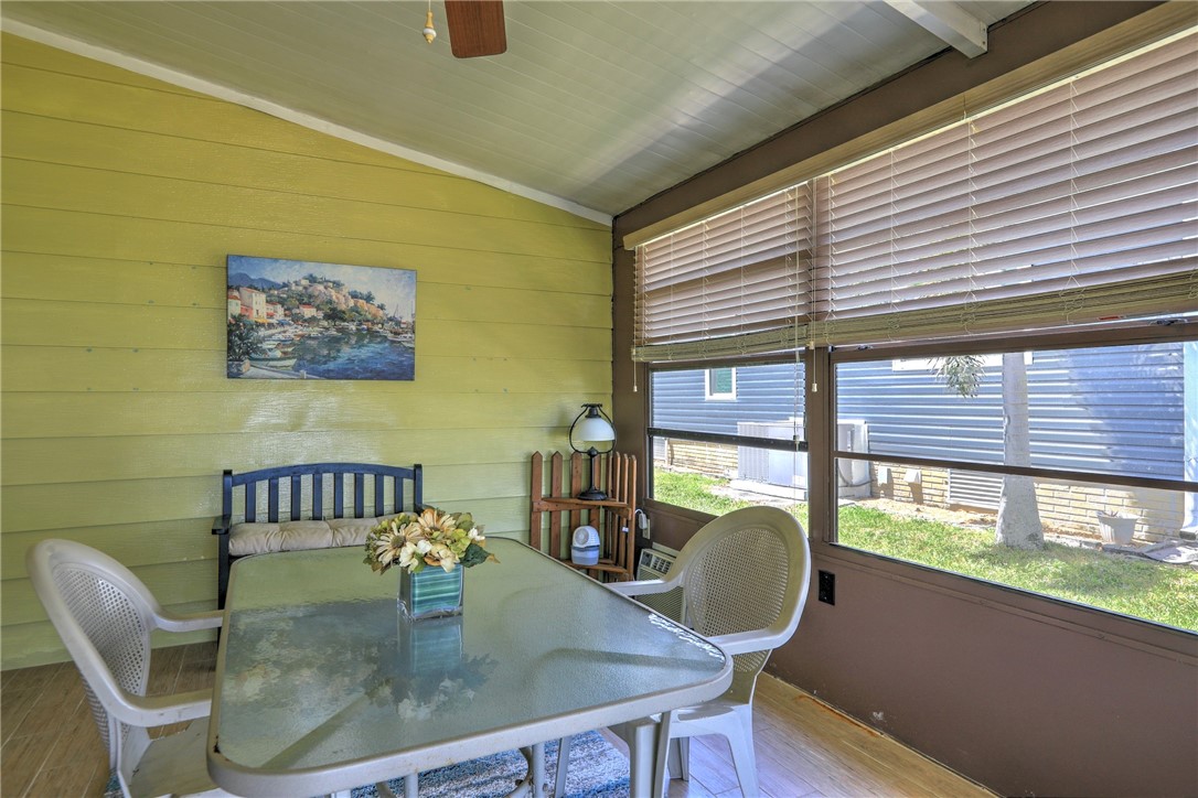 809 Oleander Circle Barefoot Bay, FL 32976 - Photo 17 of 29 a dining room with furniture and a window