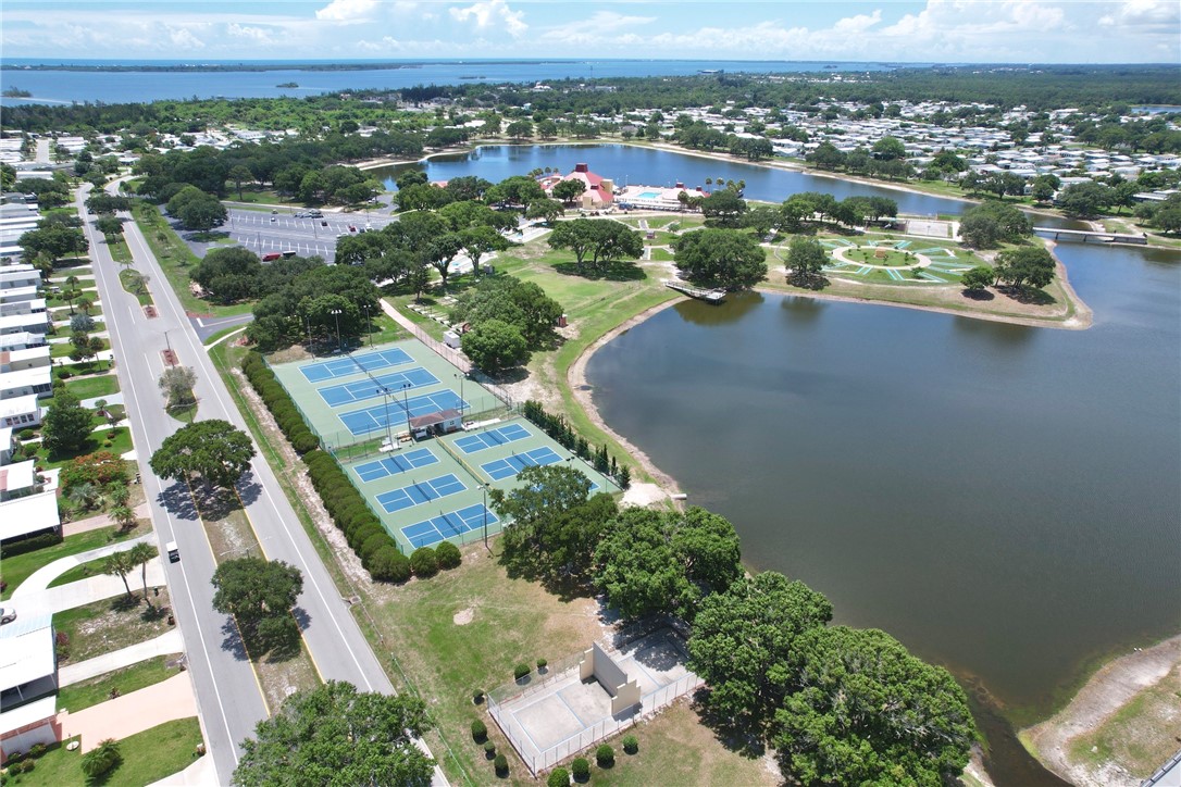809 Oleander Circle Barefoot Bay, FL 32976 - Photo 21 of 29 an aerial view of residential houses with outdoor space
