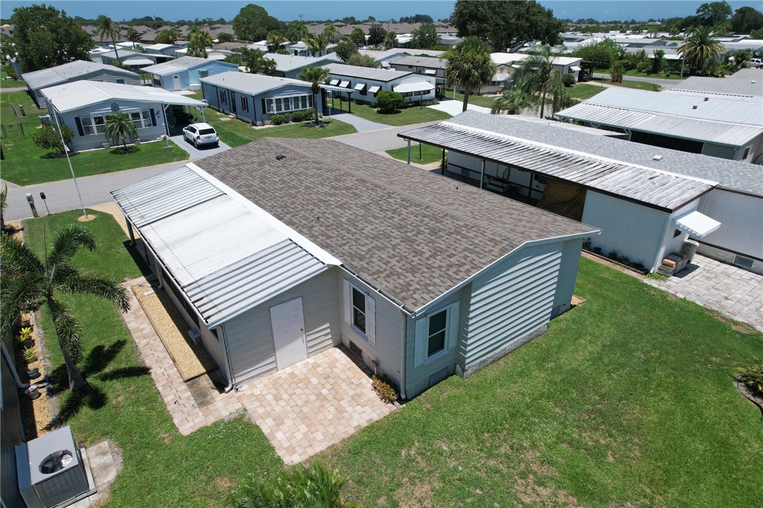 809 Oleander Circle Barefoot Bay, FL 32976 - Photo 3 of 29 an aerial view of a house having yard