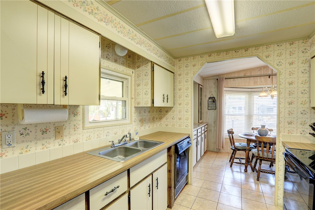809 Oleander Circle Barefoot Bay, FL 32976 - Photo 8 of 29 a kitchen with a sink and cabinets