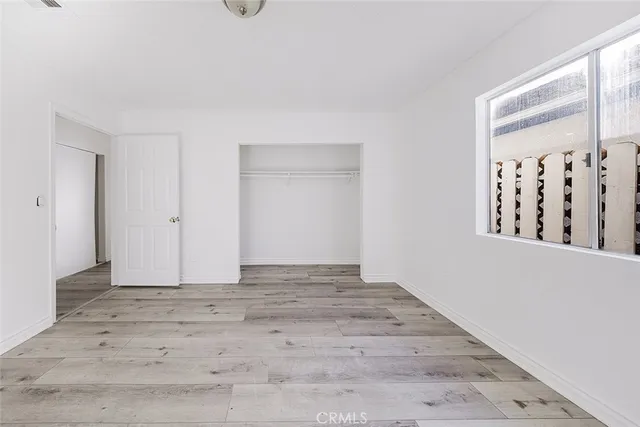 a view of an empty room with windows