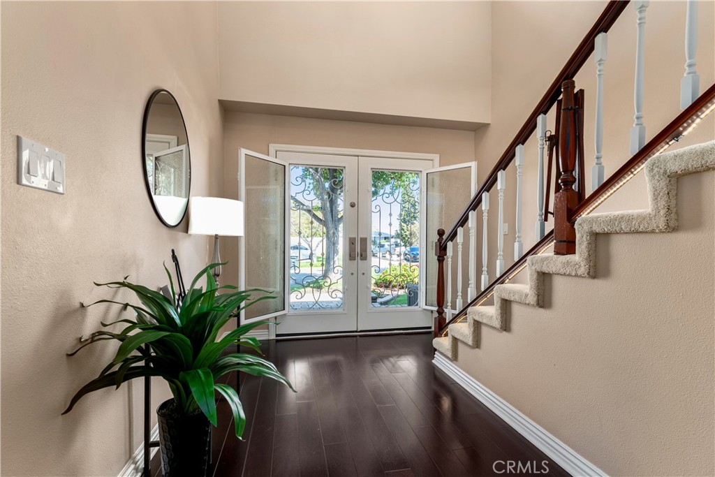 390 North Milford Road Orange, CA 92867 - Photo 4 of 70 Welcoming front entry with custom doors that are screened and you can open the glass for fresh air.