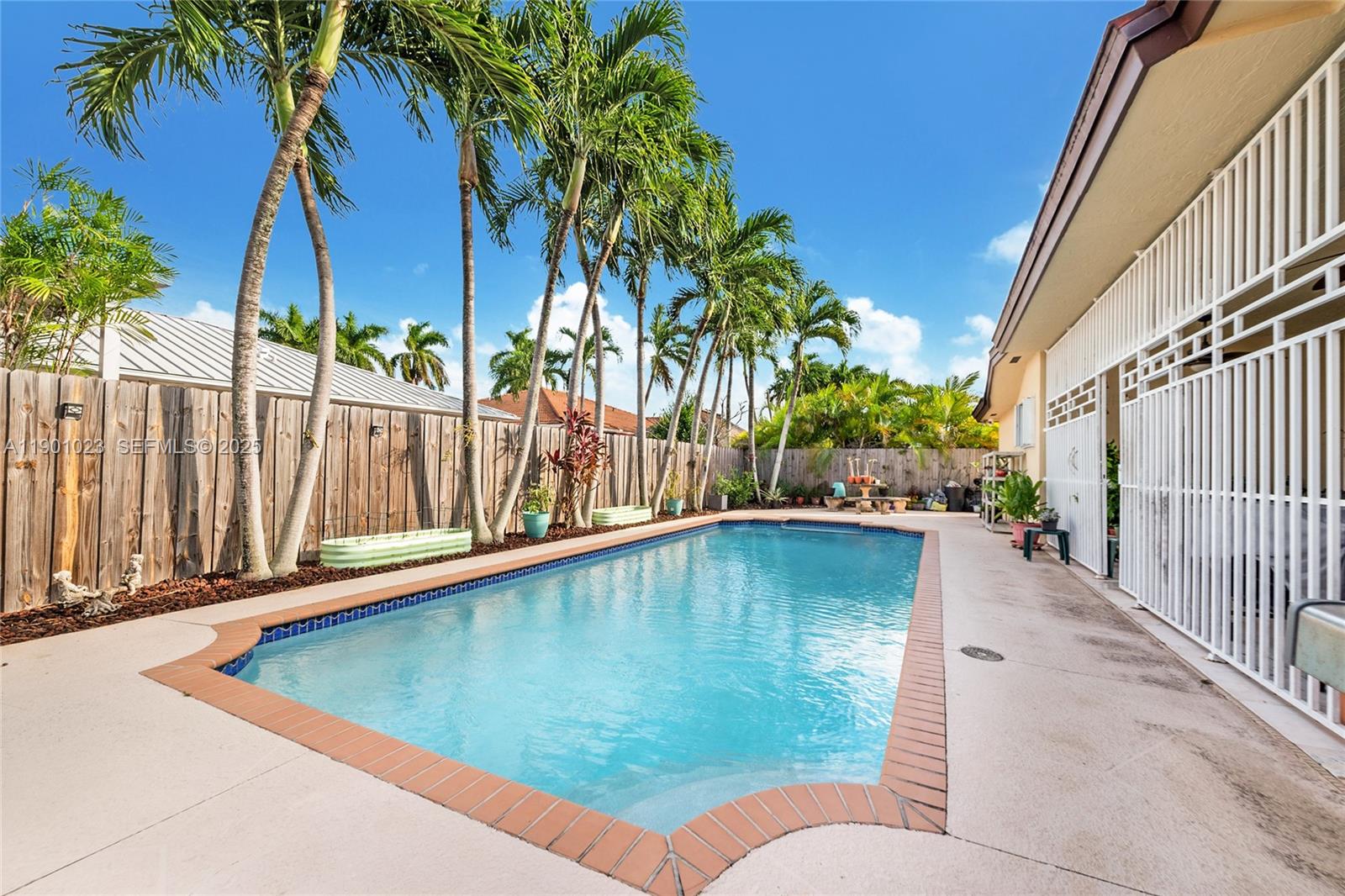 3743 Southwest 133rd Place Miami, FL 33175 - Photo 22 of 26 a view of swimming pool with a patio