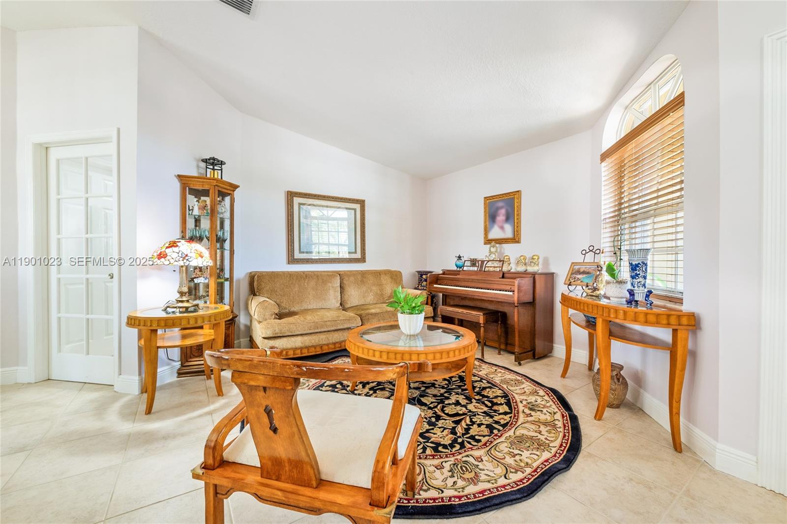 3743 Southwest 133rd Place Miami, FL 33175 - Photo 4 of 26 a living room with a couch and a table