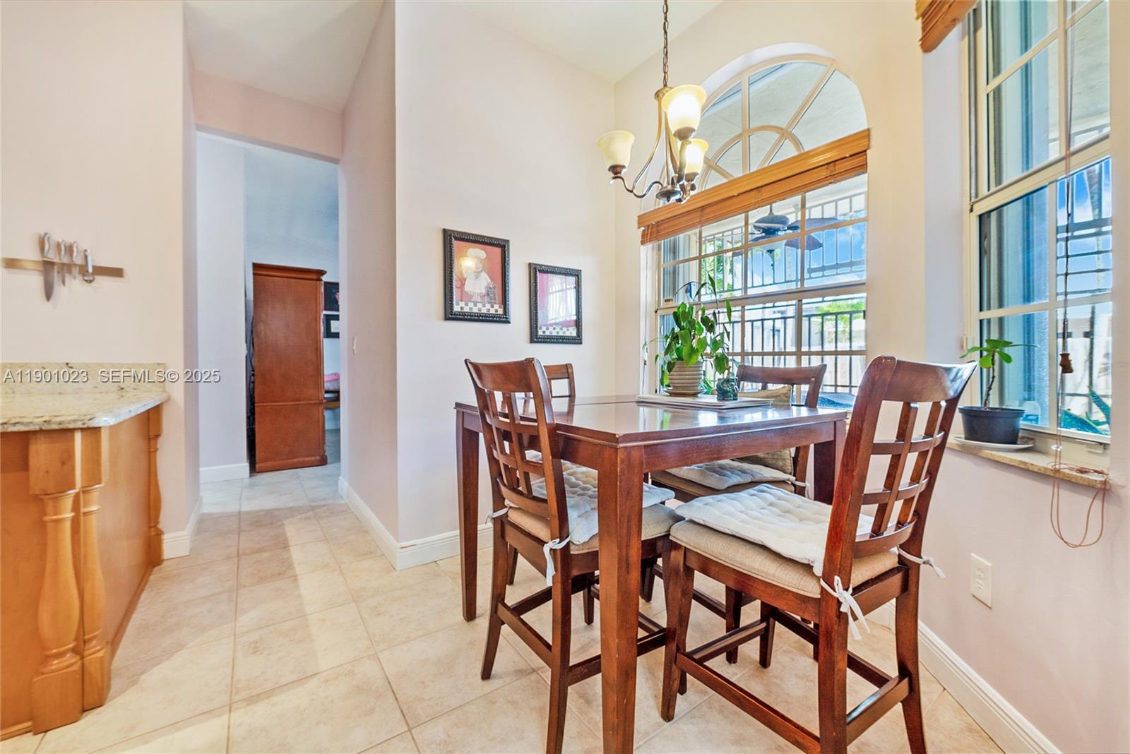 3743 Southwest 133rd Place Miami, FL 33175 - Photo 8 of 26 a view of a dining room with furniture window and outside view