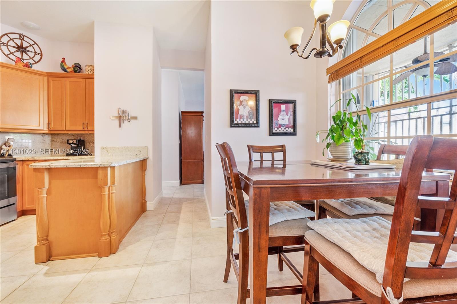 3743 Southwest 133rd Place Miami, FL 33175 - Photo 10 of 26 a dining room with furniture and window