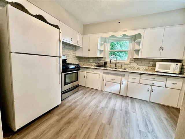 a view of balcony with wooden floor