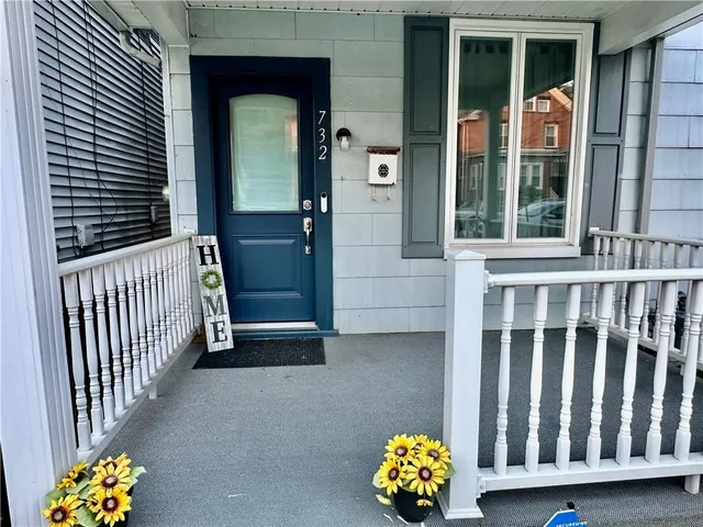 a view of a porch with a door and chair