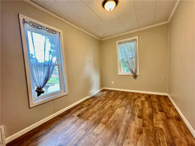 a view of a house with a small yard