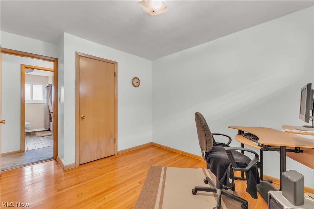 3023 Norris Avenue Cleveland, OH 44134 - Photo 22 of 41 Interior room featuring wood-finish flooring, white walls, and wood-finish trim