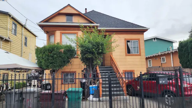 a view of a house with wooden fence and floor