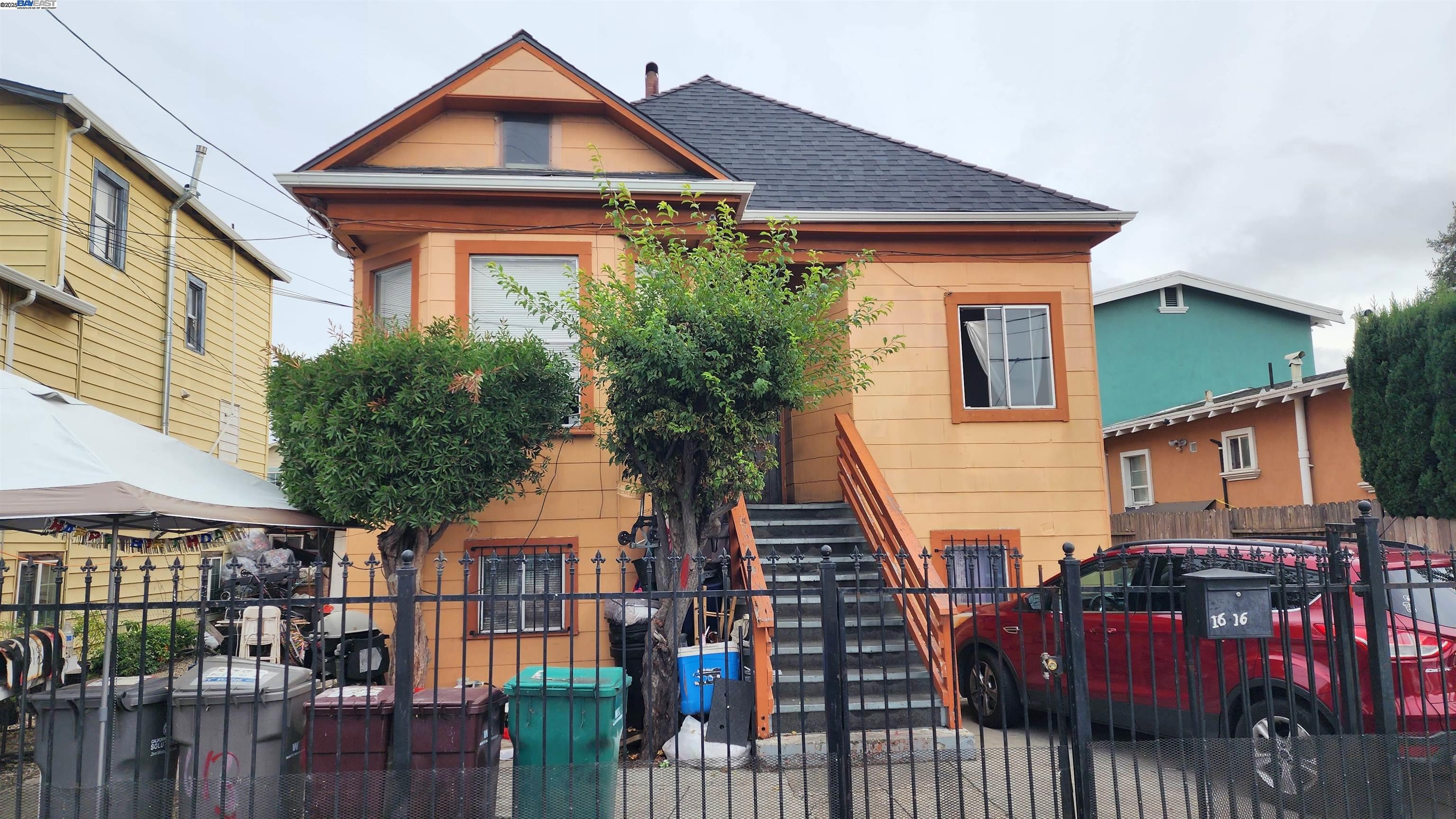 a view of a house with wooden fence and floor