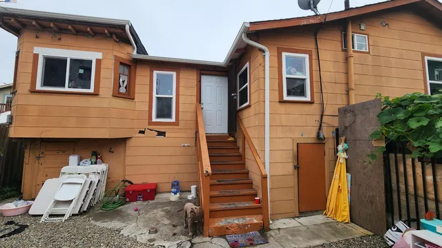 a view of a house with a door and wooden floor