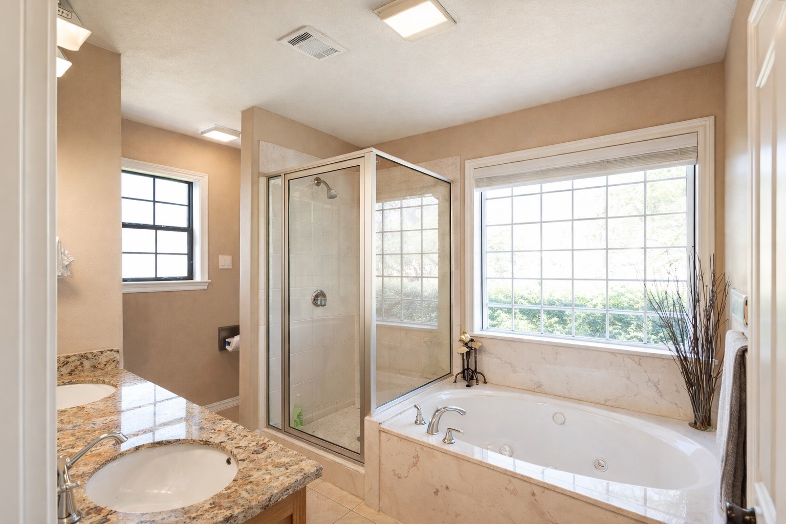 3597 Open Range Court Bryan, TX 77808 - Photo 6 of 8 a bathroom with a granite countertop tub sink and mirror