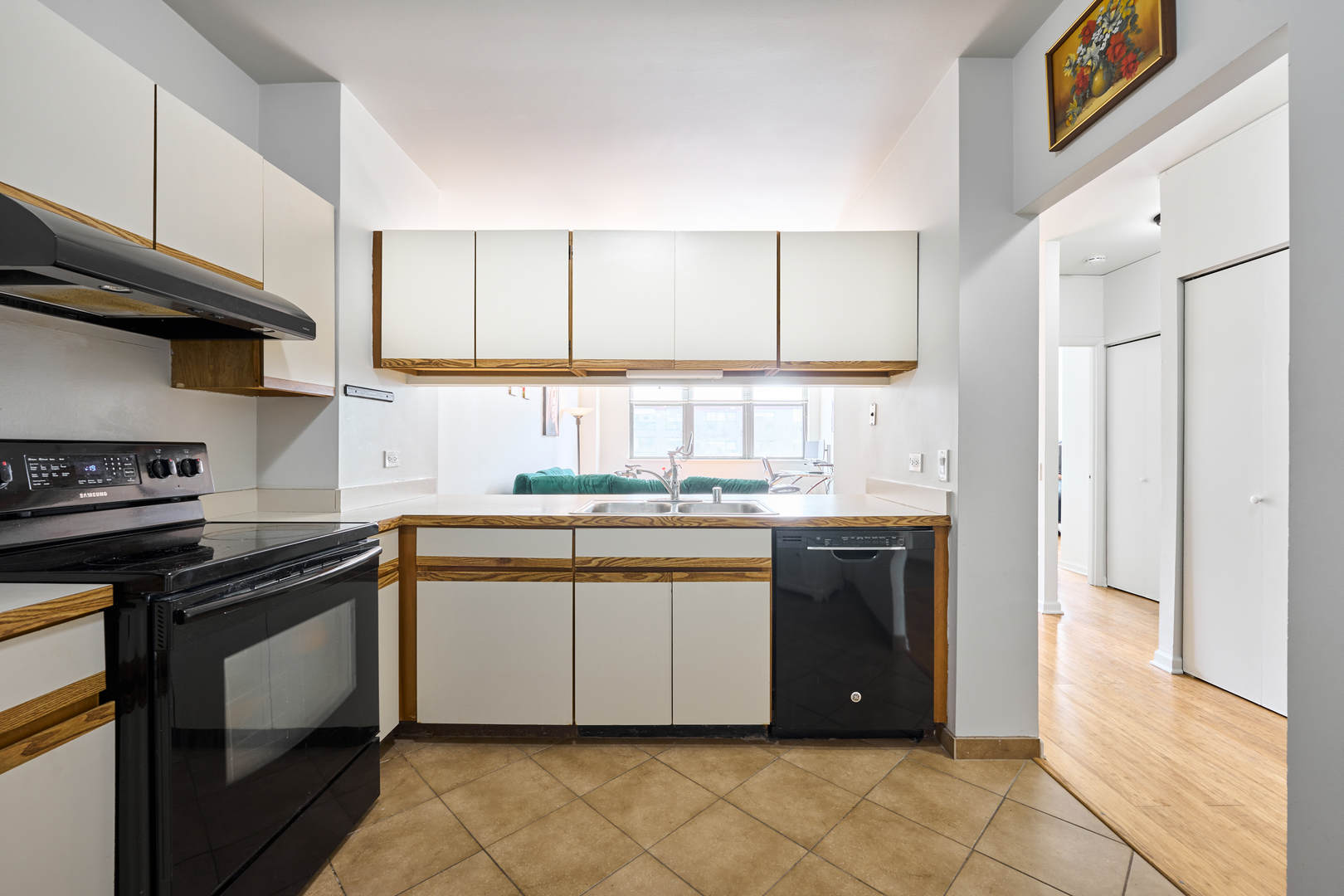 780 South Federal Street, Unit 310 Chicago, IL 60605 - Photo 6 of 18 a kitchen with stainless steel appliances granite countertop a stove a sink and a refrigerator