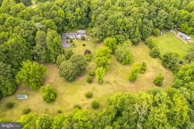 a backyard of a house with lots of green space