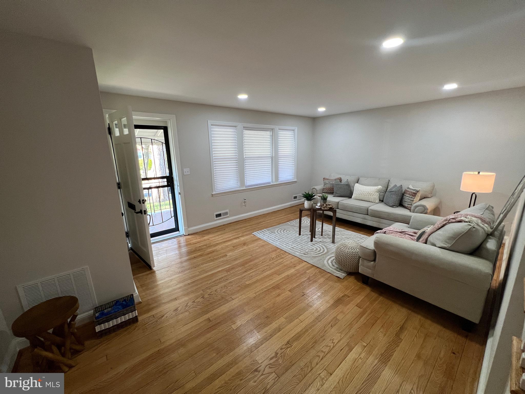 1655 Winford Road Baltimore, MD 21239 - Photo 2 of 44 a living room with furniture and a wooden floor