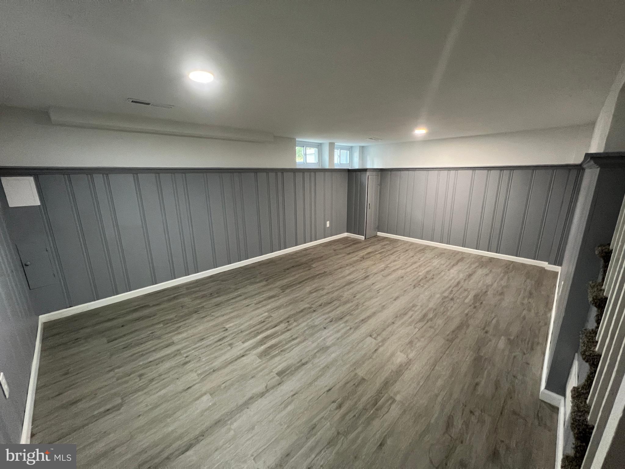 1655 Winford Road Baltimore, MD 21239 - Photo 30 of 44 an empty room with wooden floor