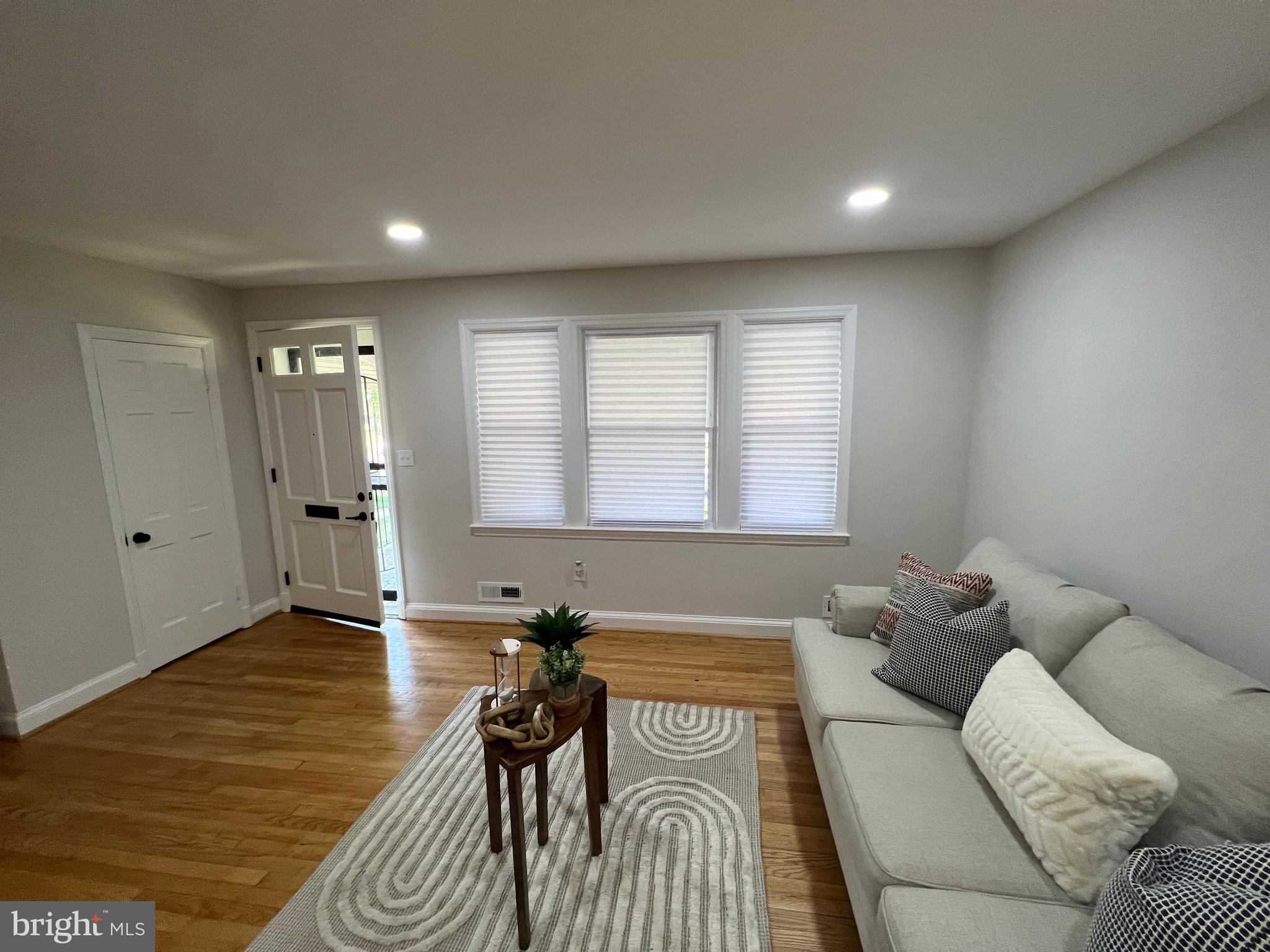1655 Winford Road Baltimore, MD 21239 - Photo 4 of 44 a living room with furniture and a wooden floor