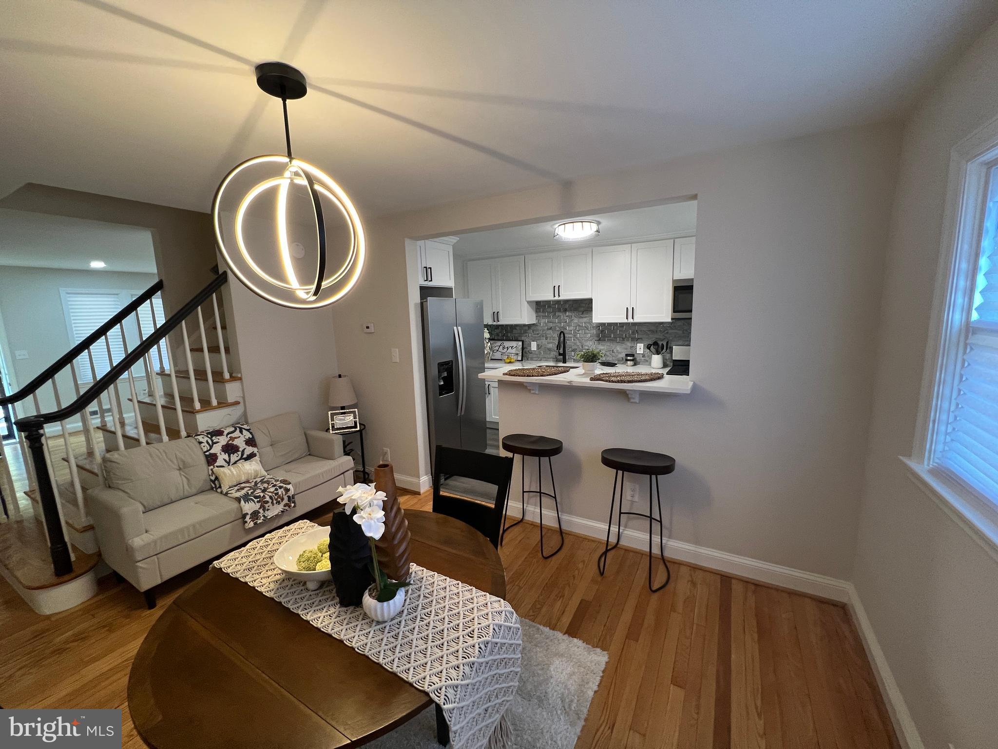 1655 Winford Road Baltimore, MD 21239 - Photo 6 of 44 a kitchen with a table and chairs