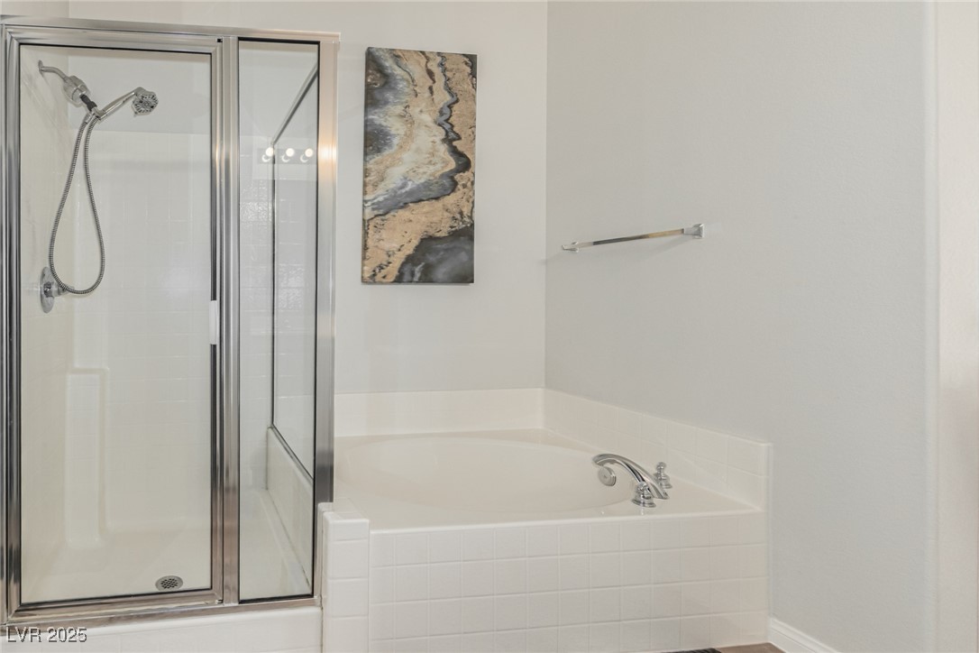 6125 Powdermill Street Las Vegas, NV 89148 - Photo 21 of 33 Full bathroom with a garden tub and a shower stall