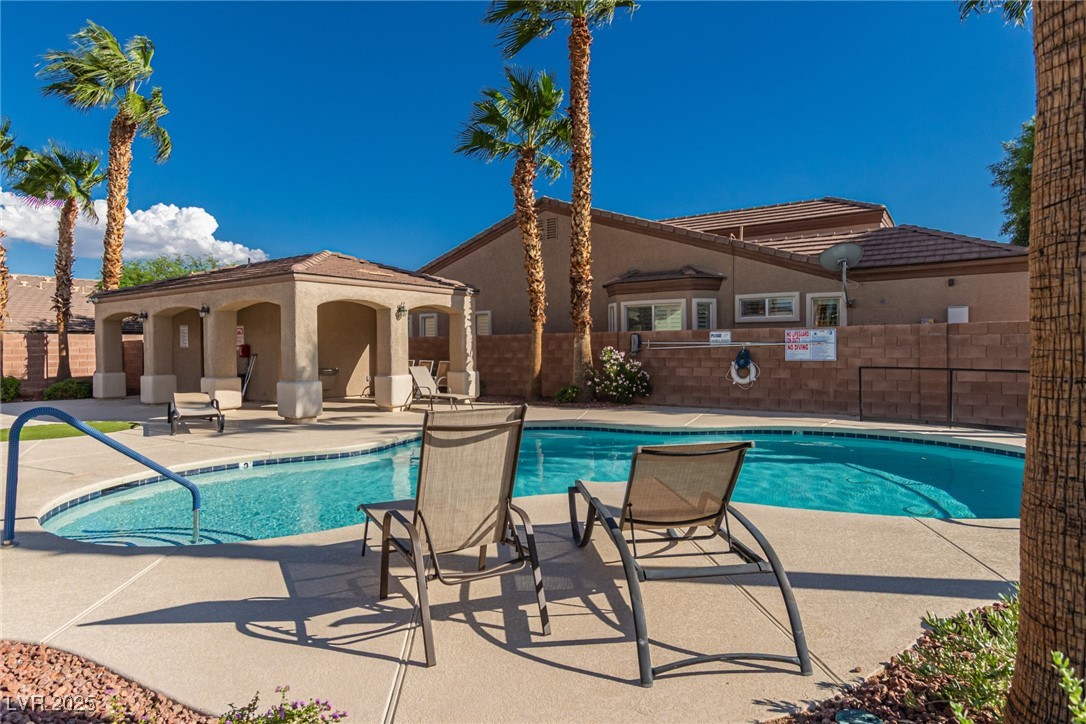 6125 Powdermill Street Las Vegas, NV 89148 - Photo 29 of 33 Community pool featuring a patio