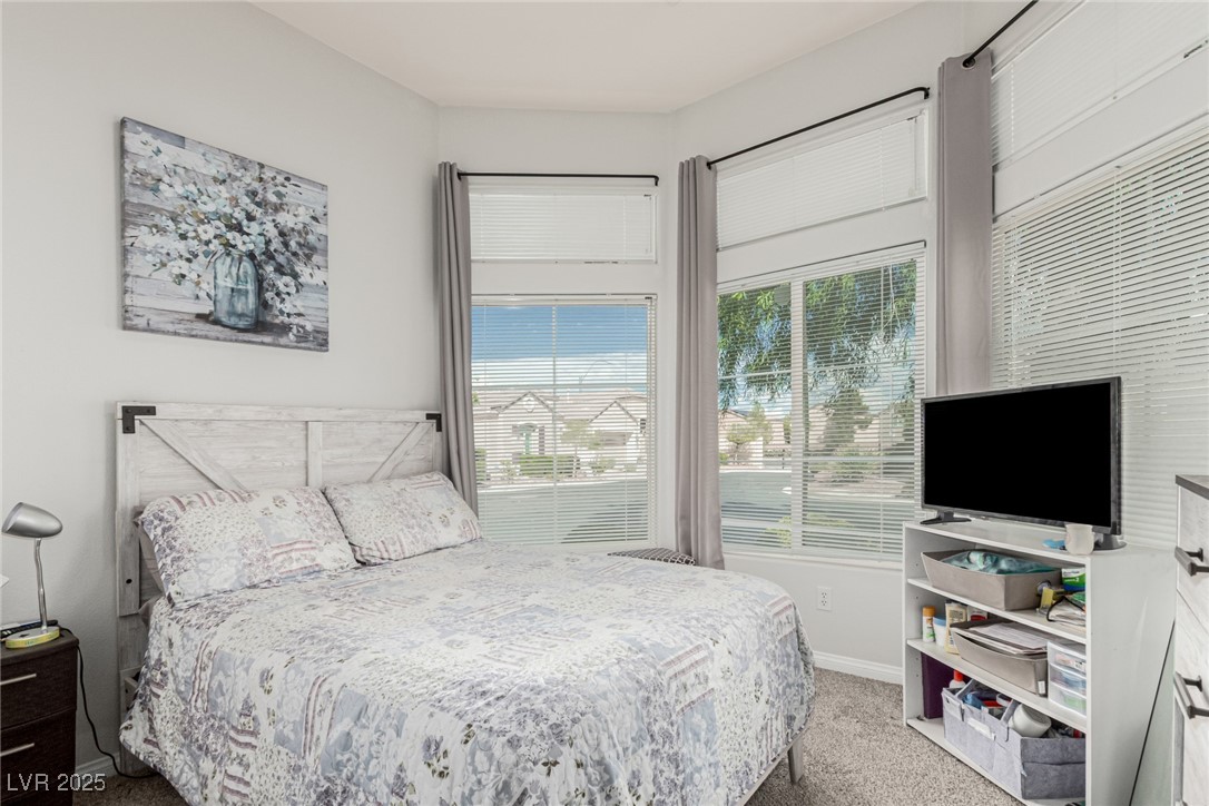 6125 Powdermill Street Las Vegas, NV 89148 - Photo 6 of 33 Bedroom featuring light carpet and baseboards