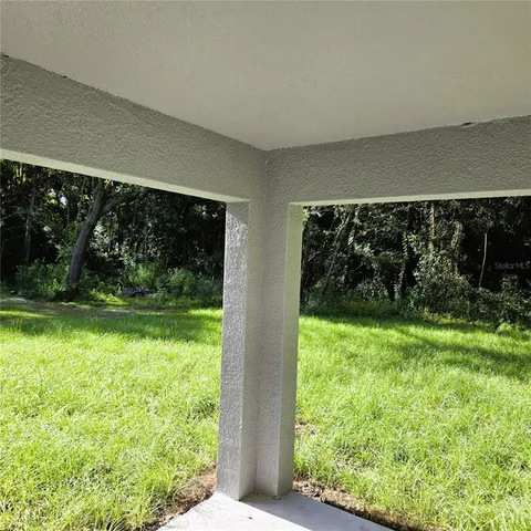 a view of a back yard from a room