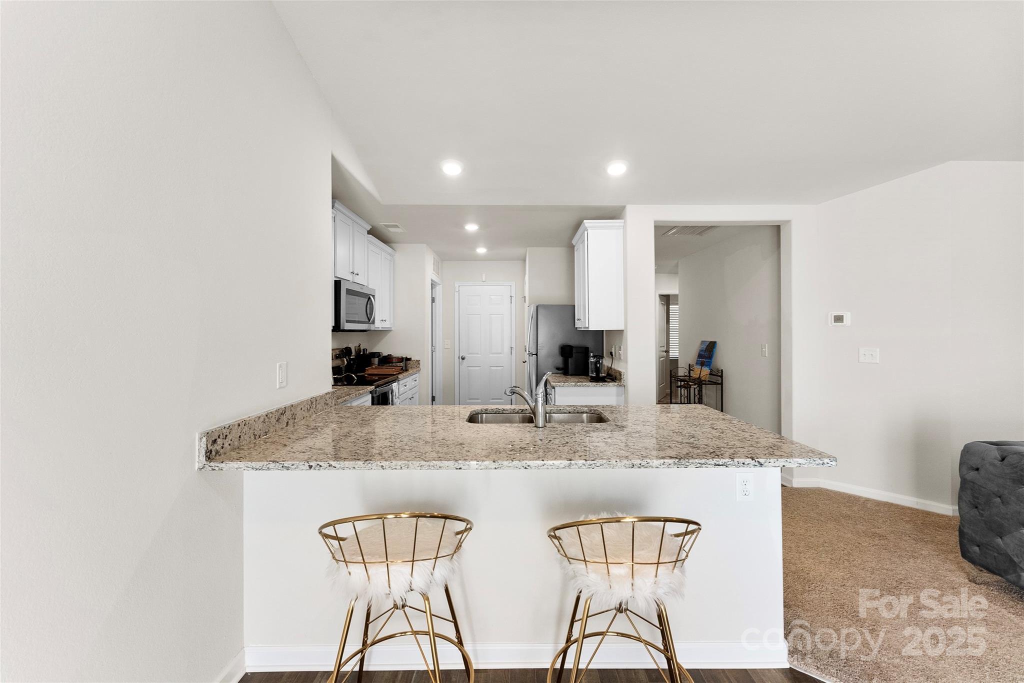 223 Frank Burns Way Kings Mountain, NC 28086 - Photo 17 of 36 a kitchen with stainless steel appliances granite countertop a sink and a refrigerator