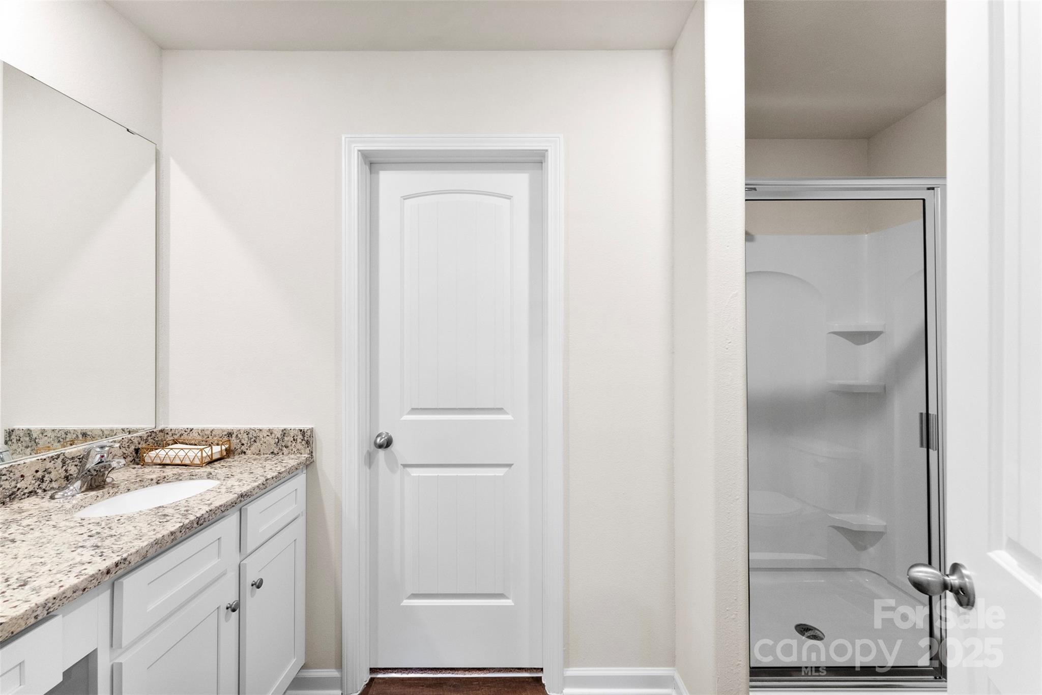 223 Frank Burns Way Kings Mountain, NC 28086 - Photo 25 of 36 a bathroom with a granite countertop sink and a mirror