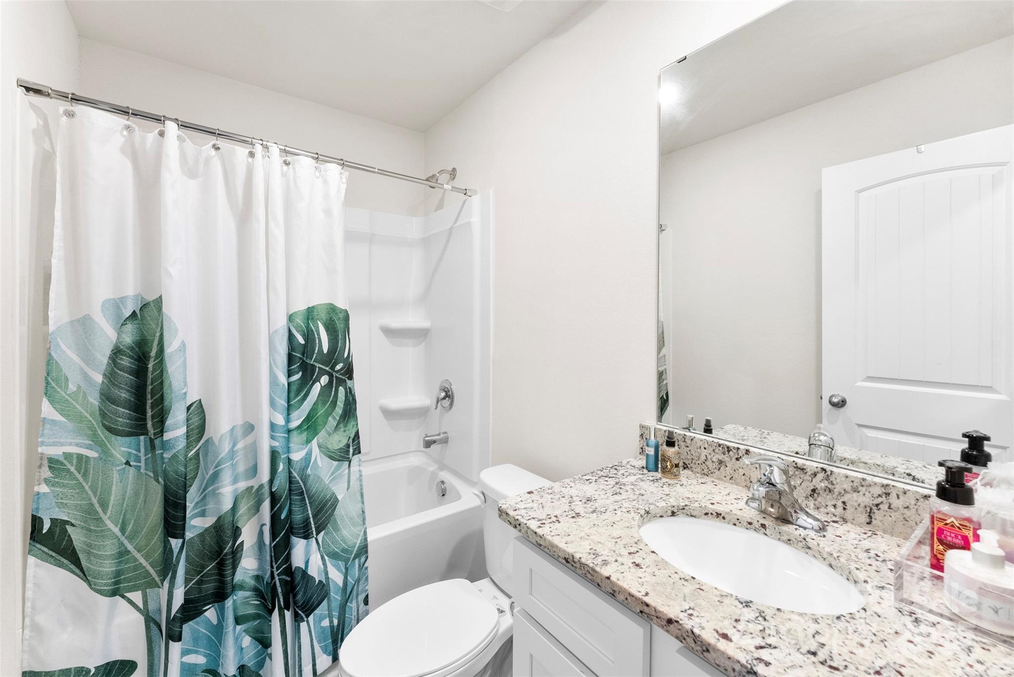 223 Frank Burns Way Kings Mountain, NC 28086 - Photo 28 of 36 a bathroom with a granite countertop sink a toilet and a mirror