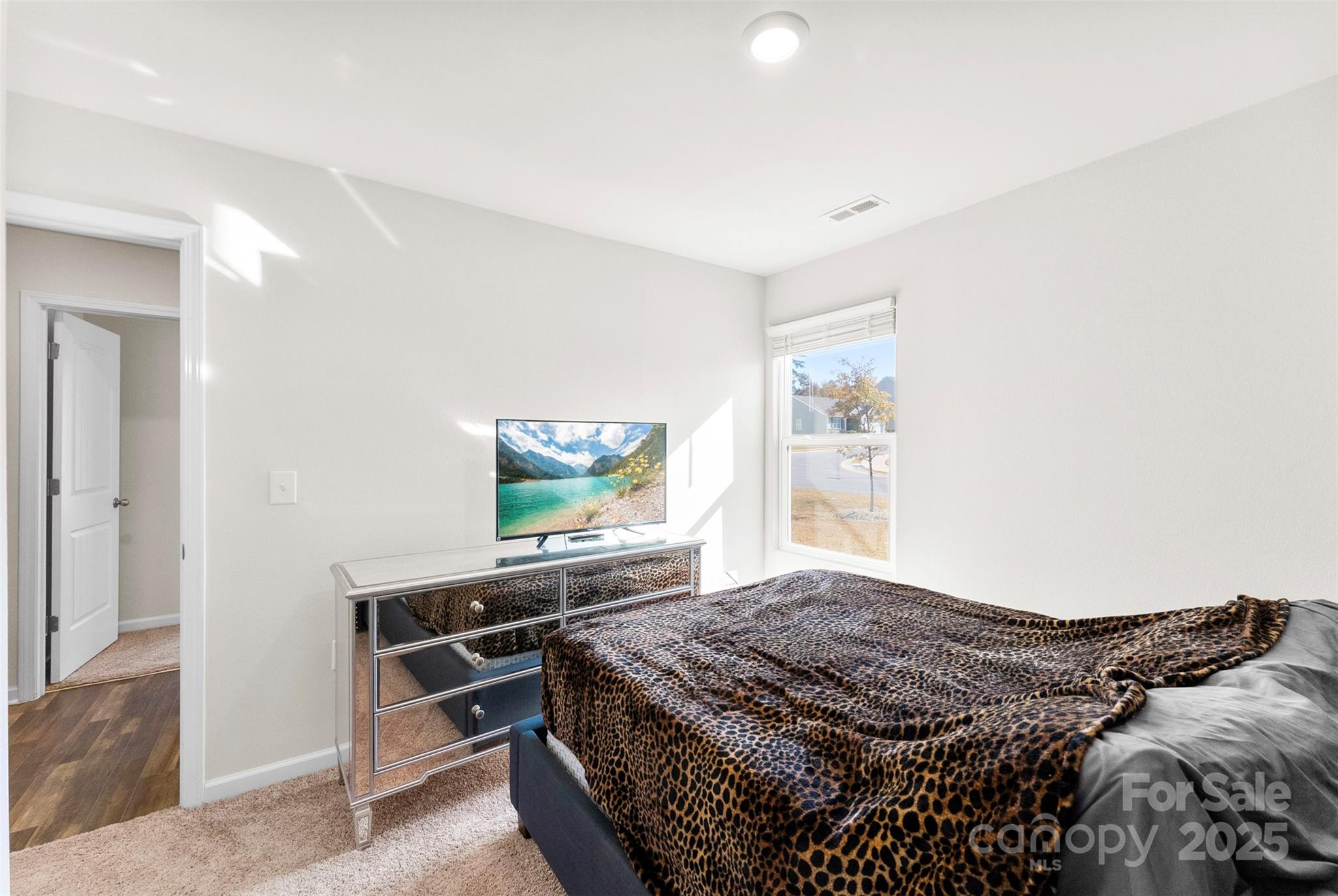 223 Frank Burns Way Kings Mountain, NC 28086 - Photo 29 of 36 a bedroom with a bed and a flat screen tv