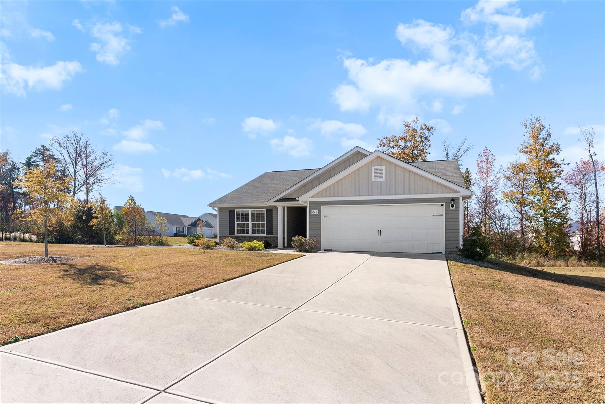 223 Frank Burns Way Kings Mountain, NC 28086 - Photo 3 of 36 a front view of a house with a yard and garage