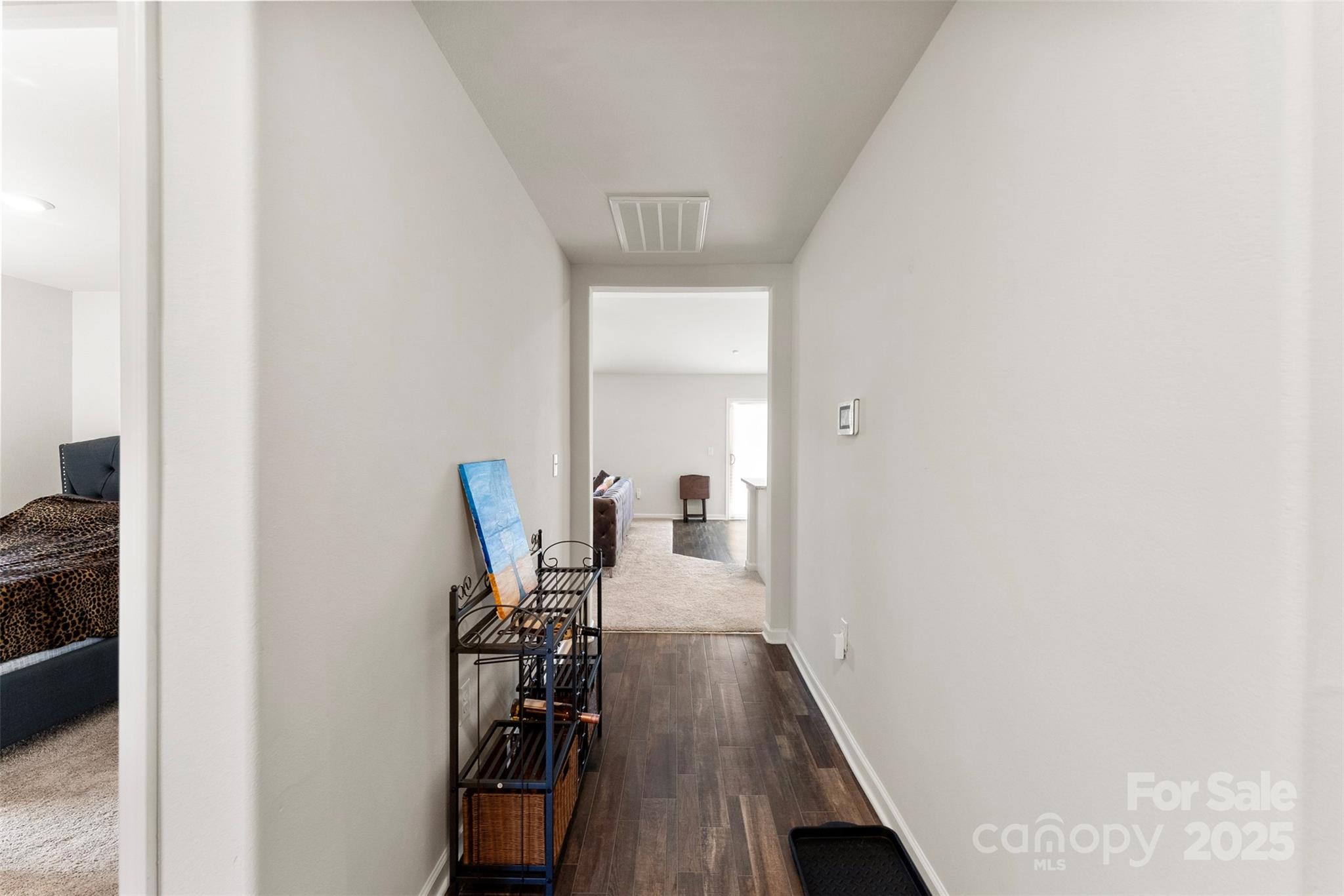 223 Frank Burns Way Kings Mountain, NC 28086 - Photo 5 of 36 a view of a hallway with wooden floor and a bathroom