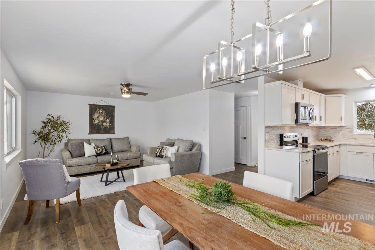 1184 Starfire Street Twin Falls, ID 83301 - Photo 11 of 34 Dining room featuring a ceiling fan and dark wood-style flooring