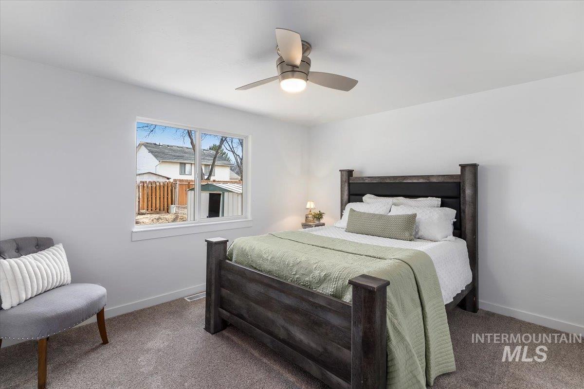 1184 Starfire Street Twin Falls, ID 83301 - Photo 15 of 34 Carpeted bedroom with a ceiling fan and baseboards