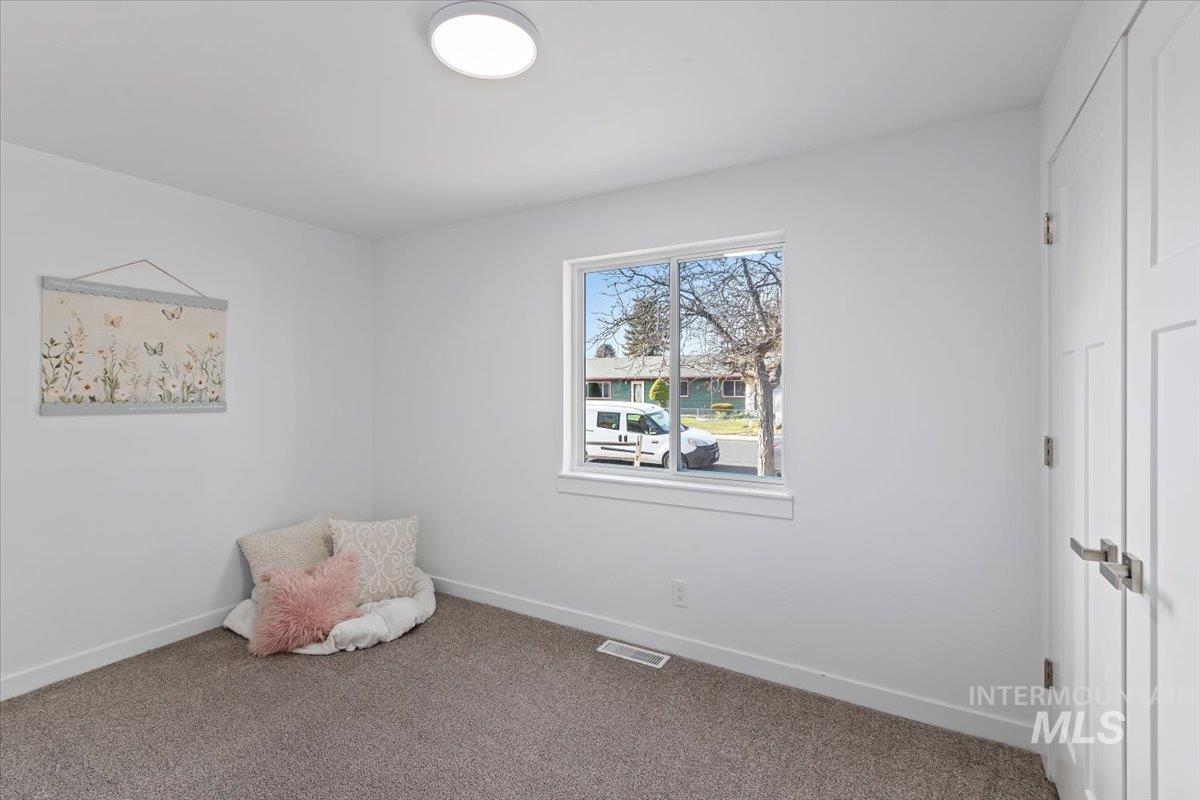 1184 Starfire Street Twin Falls, ID 83301 - Photo 19 of 34 Unfurnished room featuring baseboards and carpet