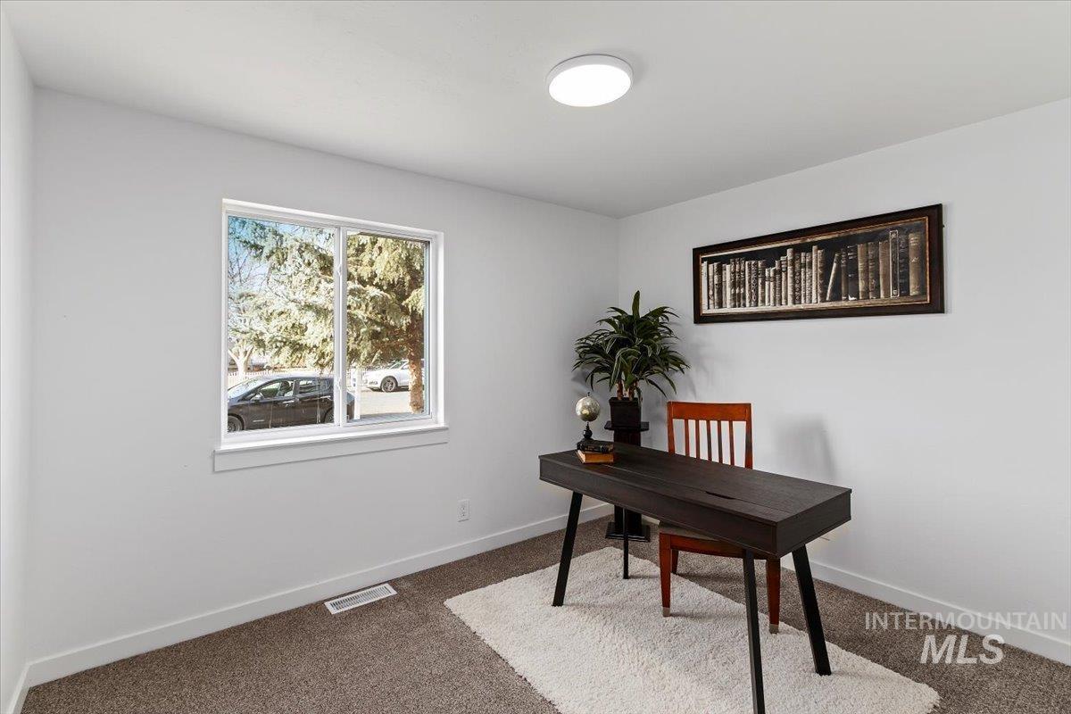 1184 Starfire Street Twin Falls, ID 83301 - Photo 20 of 34 Office area featuring dark colored carpet and baseboards