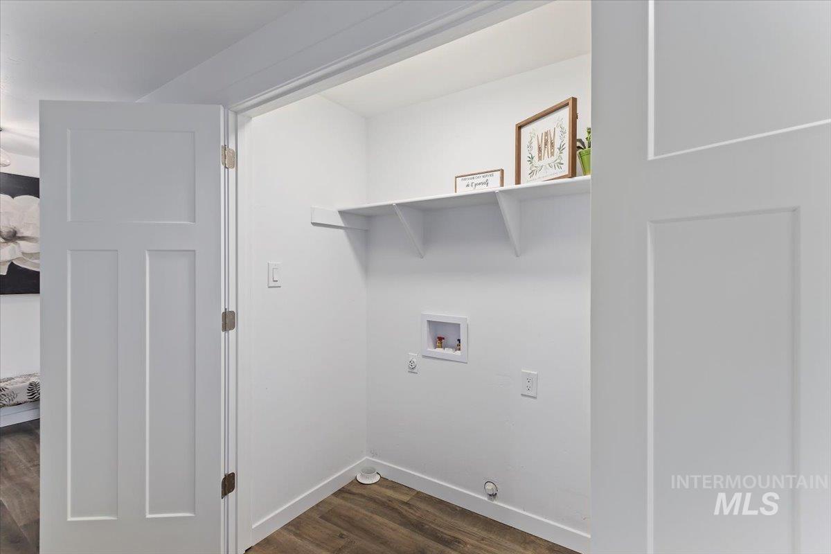 1184 Starfire Street Twin Falls, ID 83301 - Photo 24 of 34 Washroom featuring dark wood finished floors and washer hookup