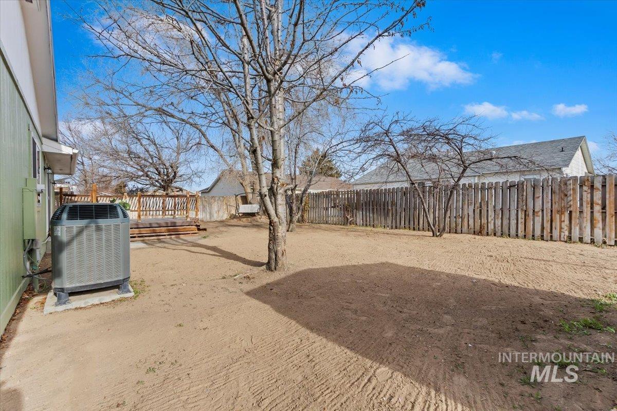 1184 Starfire Street Twin Falls, ID 83301 - Photo 32 of 34 Fenced backyard with a deck