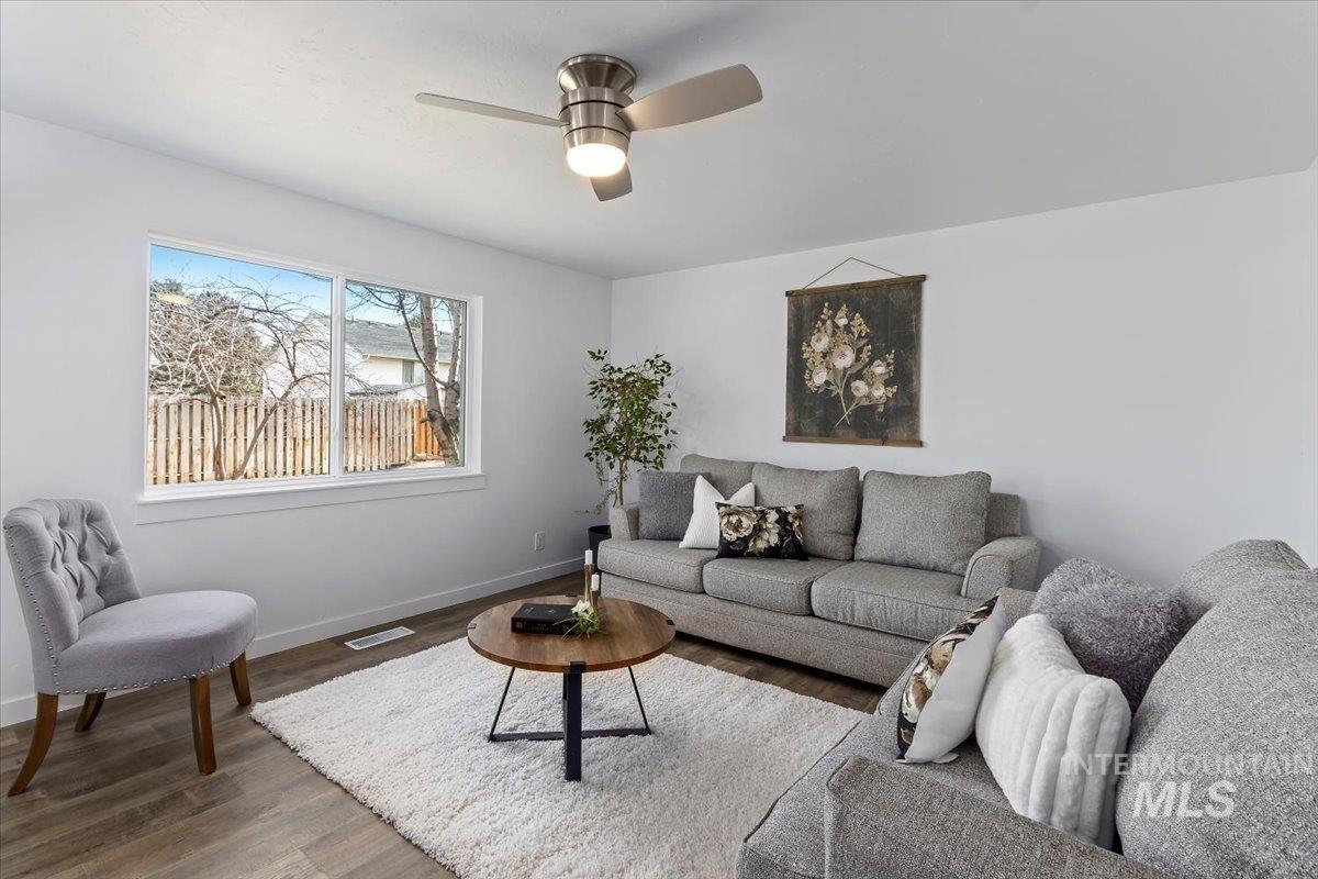 1184 Starfire Street Twin Falls, ID 83301 - Photo 7 of 34 Living area with wood finished floors and a ceiling fan