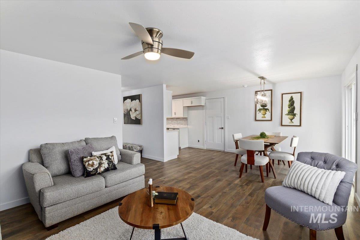 1184 Starfire Street Twin Falls, ID 83301 - Photo 8 of 34 Living room featuring dark wood-style flooring and a ceiling fan